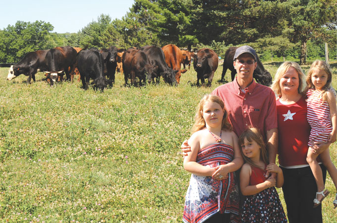 The Glenn family of Glenn Farms and their herd