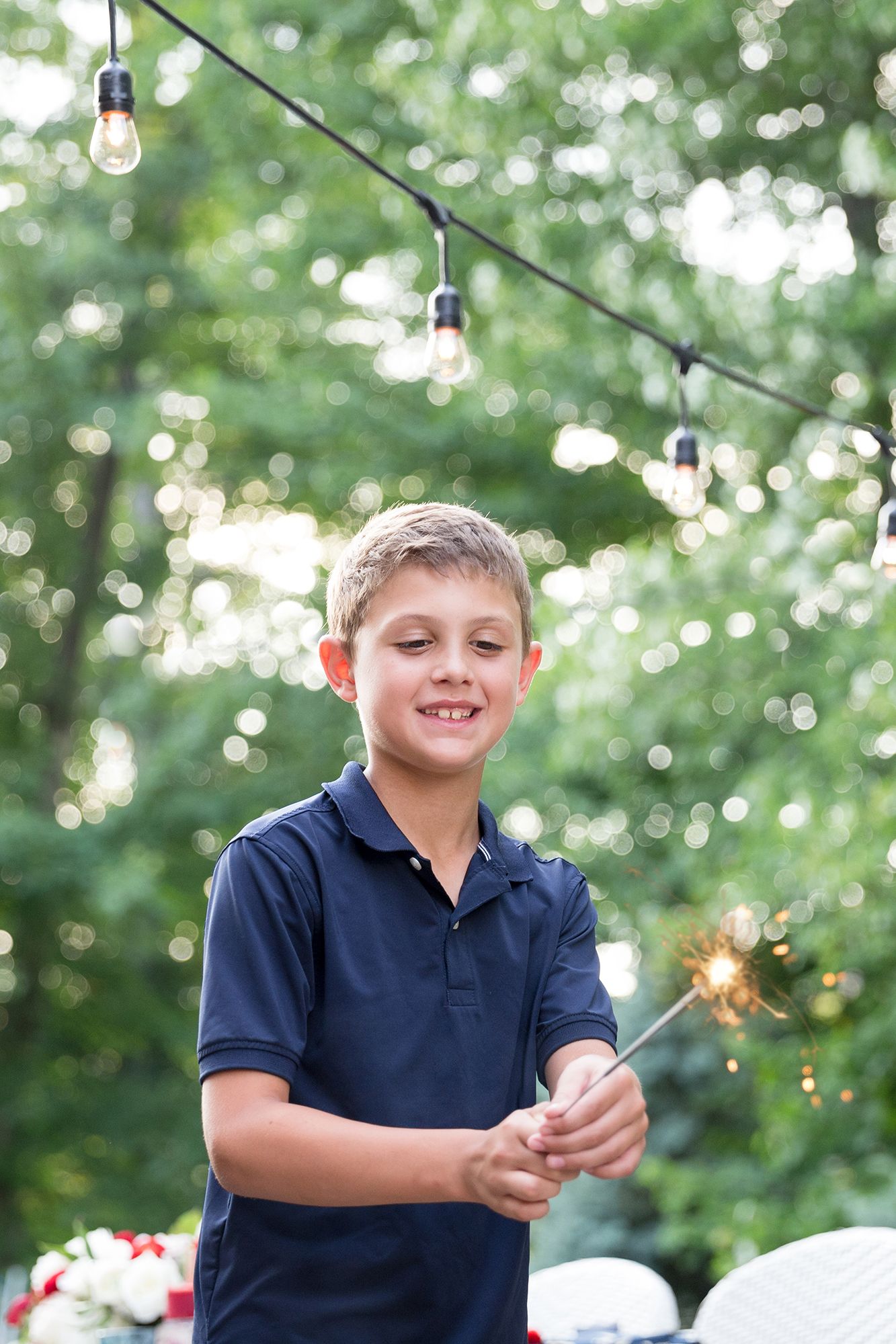 One Stylish Party - Boy holding a sparkler