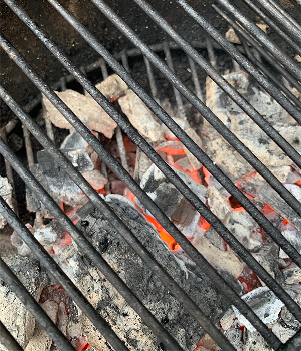 Charcoal grill before being cleaned in preparation for summer