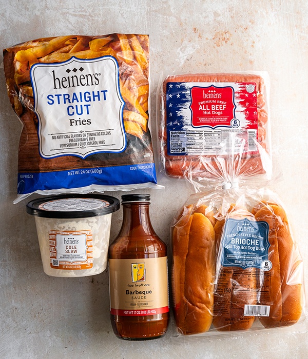 Ingredients for Cleveland Dog (Heinen's Frozen Fries, Heinen's Cole Slaw, Two Brothers' BBQ Sauce, Heinen's Brioche Buns, and Heinen's All Beef Hotdogs)