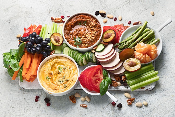 Snacks that promote bone health, such as fruits, veggies, nuts, and dips