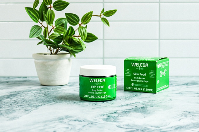 Weleda Body Butter on a marble countertop