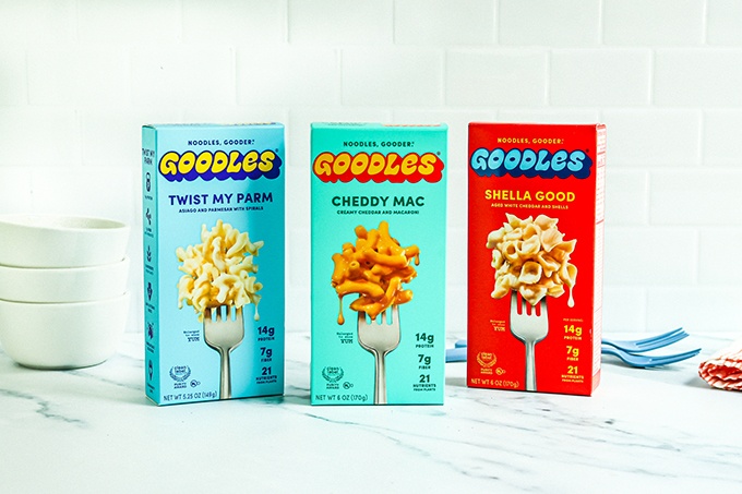 One great lunch item for your back-to-school grocery list: 3 boxes of Goodles Mac and Cheese varieties on a white countertop