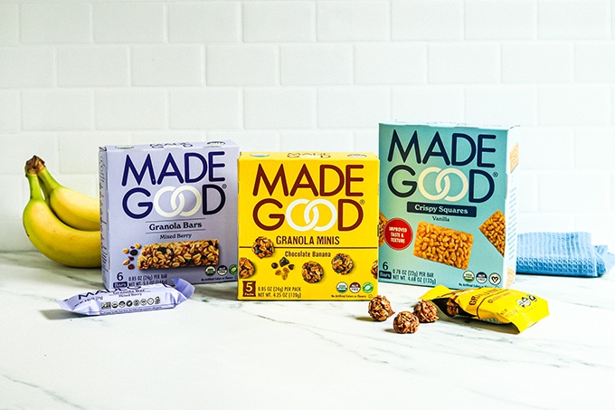 3 boxes of MadeGood snacks (Granola Bars, Granola Minis, and Crispy Squares) on a white countertop