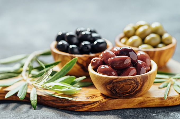 3 small bowls of assorted olives