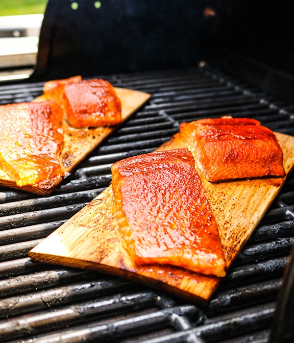 Salmon being grilled on a cedar plank