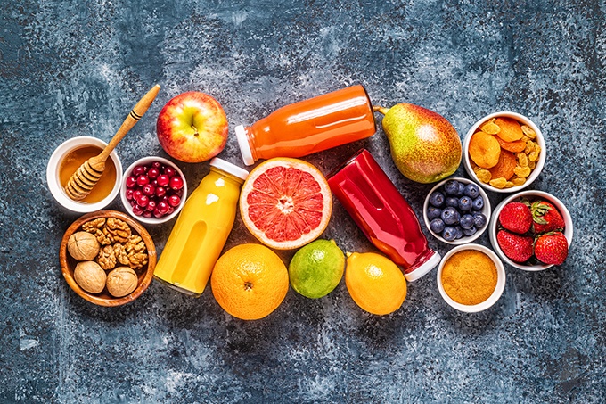 An Overhead Image of foods that boost Immune Strength Boosting Foods such as Vitamin C Rich fruits and juices