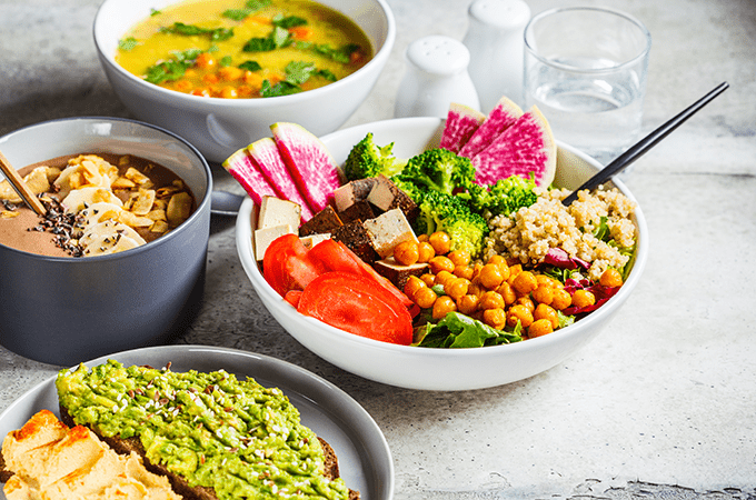 A Tablescape  Featuring a Salad, Soup, Yogurt Bowl, and Avocado Toast