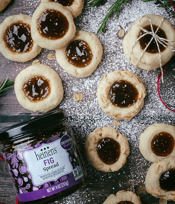 Fig Thumbprint Cookies Beside a Jar of Heinen's Fig Spread