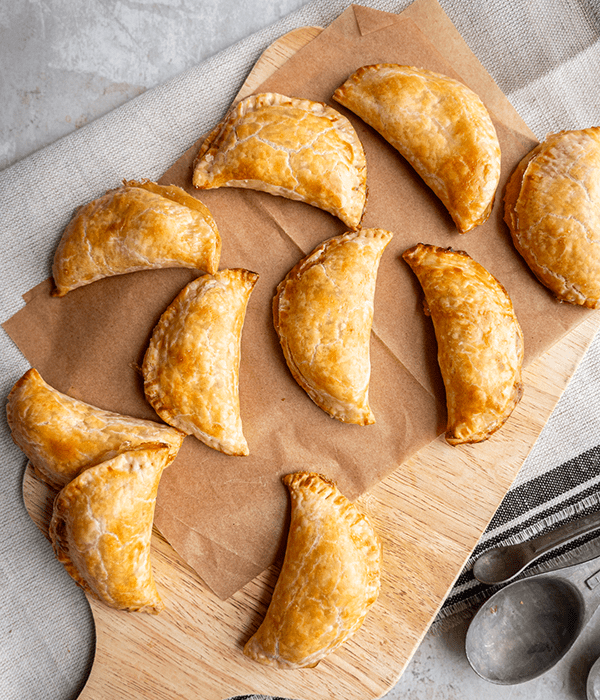 Baked Apple Hand Pies on a Piece of Brown Parchment Paper