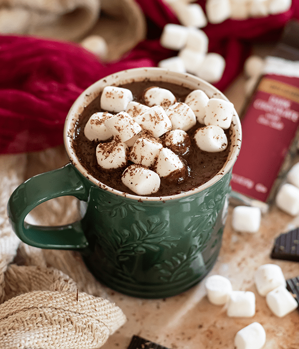 A Green Mug full of Boozy Hot Chocolate and Mini Marshmallows