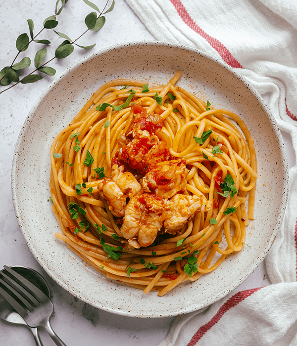 A Birds-Eye Image of Lobster Fra Diavolo in a Large Bowl