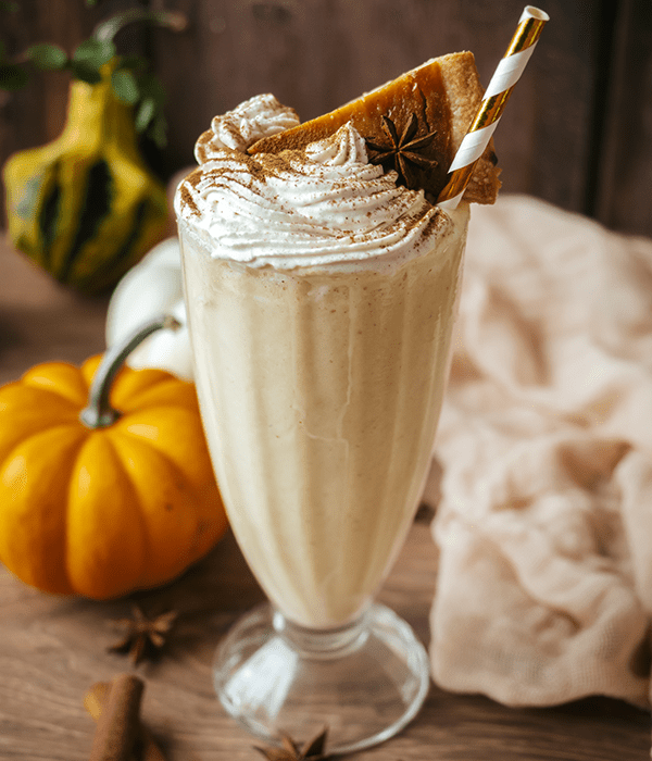 Leftover Pumpkin Pie Milkshake in a Milkshake Glass with a Straw