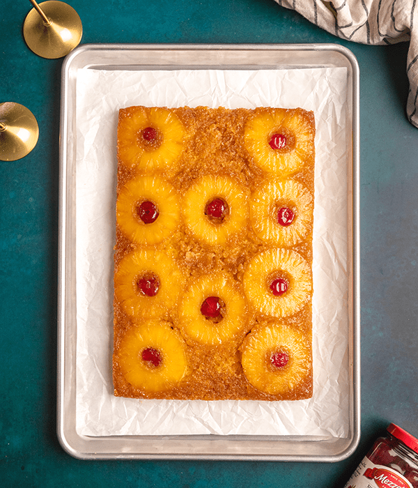 A Full Pineapple Upside Down Cake on a Sheet Tray