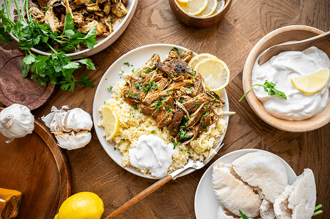 Chicken Shawarma over couscous served with Greek yogurt and lemon. 